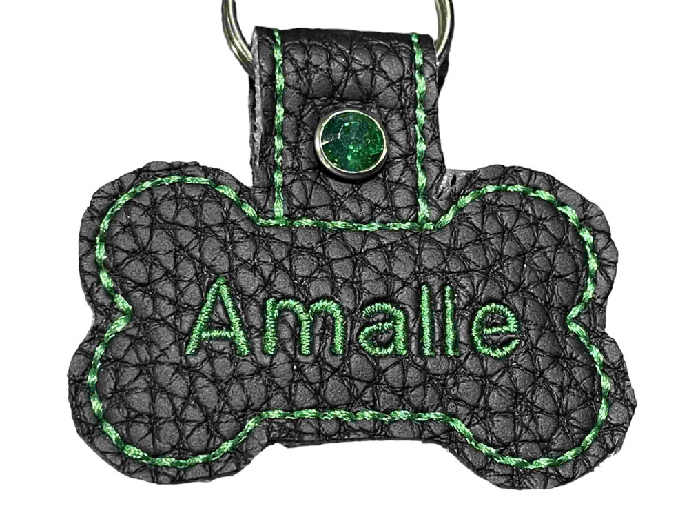 Navnetags kødben i sort kunstlæder