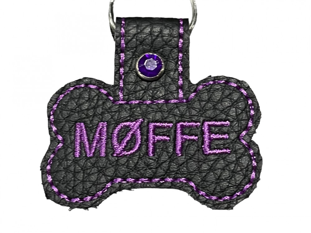 Navnetags kødben i sort kunstlæder