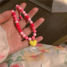 Perlekæde i rosa/pink med gult hjerte